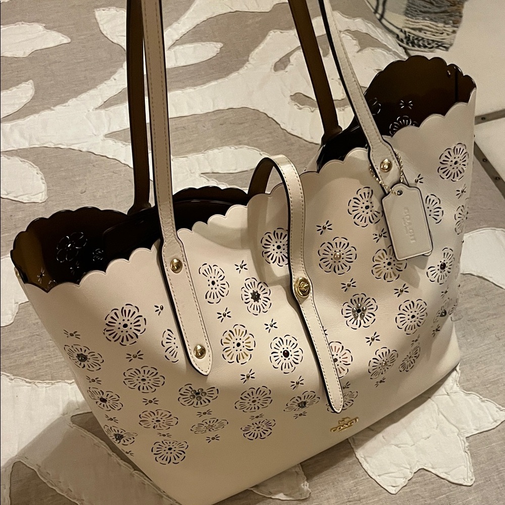 Coach Cream Floral Cutout Tote.  Like new.  Comes with its original dust bag.